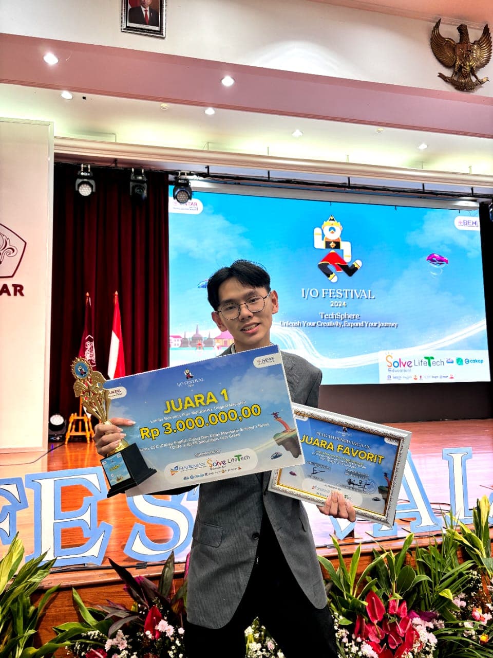 Richard holding first-place awards at the I/O Festival